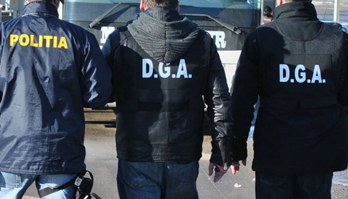 Flagrant DGA în sănătate – Ginecolog din Giurgiu, prins când primea mită pentru o cezariană