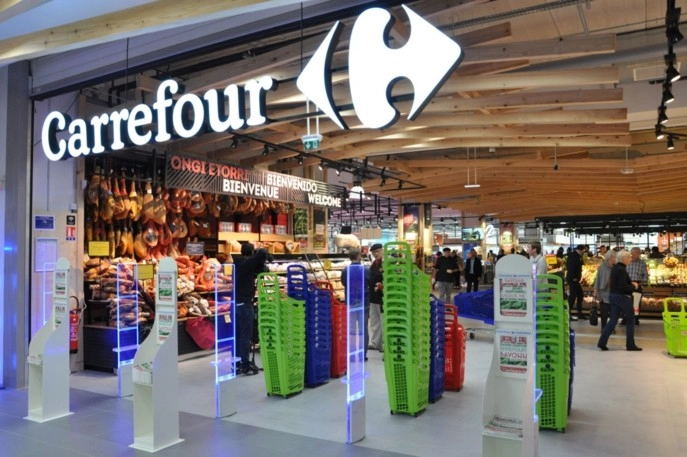 Costurile preluării Cora și Match trag în jos profitul Carrefour